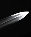 Close-up of the blade of a Fully Handmade Damascus Steel Folding Blade Sword With Rosewood Scabbard And Brass Fittings Heat Tempered.