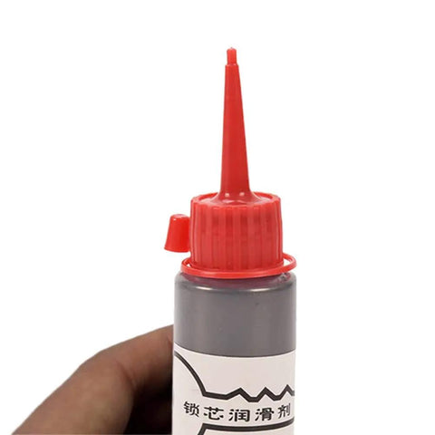 Close-up of a 60ml bottle of Graphite Garage Door And Lock Lubricant 60ml Oil Free Powder Formula For Sliding Doors And Hinges with red cap.