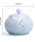 Airtight Ceramic Coffee Canister Porcelain Tea Caddy With Tight Seal Lid Keeps Your Stash Fresh As A Dime For Kitchen Pantry Organization Blue Jar, round with lid.