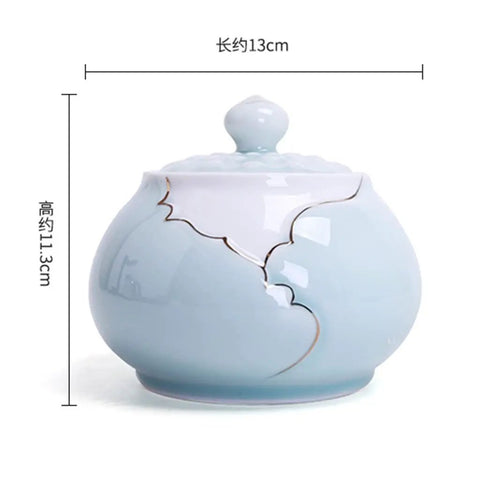 Airtight Ceramic Coffee Canister Porcelain Tea Caddy With Tight Seal Lid Keeps Your Stash Fresh As A Dime For Kitchen Pantry Organization Blue Jar, round with lid.