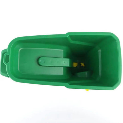 Top view of green All Purpose Handheld Grass Seed Spreader for Lawn Care that spreads grass seed, salt, and ice melt year round