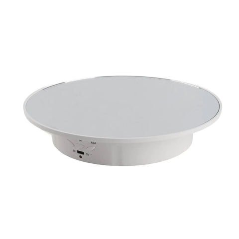This Badass 360 Degree Electric Rotating Display Turntable Slams With 8Kg Load Capacity And Three Adjustable Speeds For Video And Photography, showcasing a white surface and control panel.