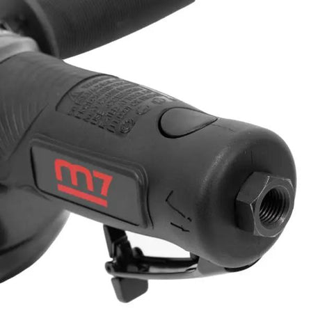 Badass 1.3 Horsepower Air Angle Grinder With 4.5 Inch Grinding Wheel And Swivel Guard Crushes Steel And Concrete Stall Resistant Motor Quick Release Turntable For Hard Core Builders handle close-up with textured grip and trigger.