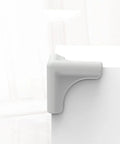 Gray corner guard on table showcasing 4 Pieces Silicone Furniture Corner Protectors Soft Desk Corner Guards For Home Safety Easy To Remove And Protective Edge Covers Durable Anti Collision Cushioned Safety Guards For Tables Desks Cabinets And Appliances Kid Safe