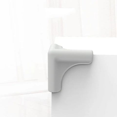 Gray corner guard on table showcasing 4 Pieces Silicone Furniture Corner Protectors Soft Desk Corner Guards For Home Safety Easy To Remove And Protective Edge Covers Durable Anti Collision Cushioned Safety Guards For Tables Desks Cabinets And Appliances Kid Safe