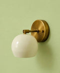 Modern Brass Wall Sconce Light Fixture with white glass shade, 5" W x 7" H size, ideal for bathroom, bedroom, or hallway.
