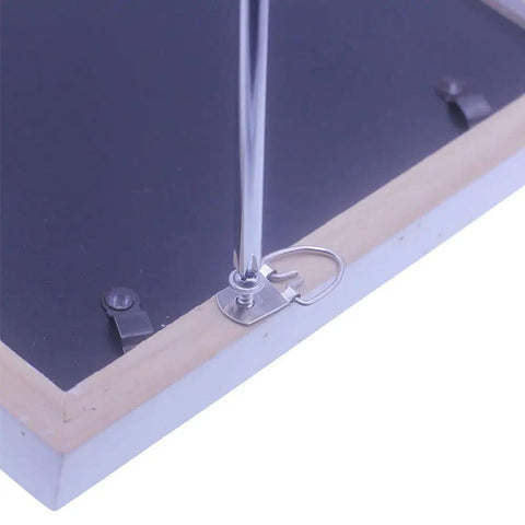 Heavy Duty D Ring Picture Hangers With Screws Set Of 50 for Picture Frames installed on wooden frame corner.