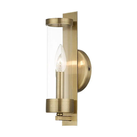Castleton Antique Brass 1 Light ADA Wall Sconce With Clear Glass Cylinder, classic yet modern hallway and bath accent lighting