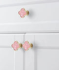 Sweet Looking Pink Clover Drawer Knobs Six Pack For Dressers And Kitchen Cupboards Smooth Zinc Alloy Hardware, pink clover knobs on white drawer.