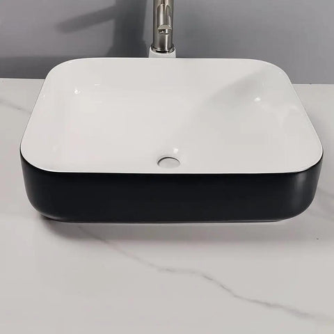 Bathroom Sink Modern Simple Black Appearance Above Counter Basin Ceramic Wash Basin Apartment Home Bathroom Ceramic Above Counter Basin Bathroom Sink Vessel, top view on marble countertop.