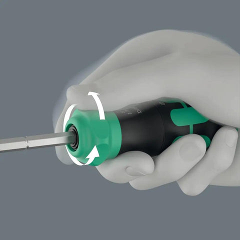 Hand holding Compact 26 RA-R Ratchet Set with fine-tooth ratchet in handle, demonstrating spinning action and intuitive operation.