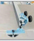Beefy Professional Grade Large Format Panel Tile Cutter Up To 130 Inches Long With Scratch Resistant Rubber Bed showing rubber coated scoring beam and wheels.