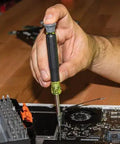 Person using All In One Precision Screwdriver Set With 39 Bits For Apple Devices Magnetic Dual End Barrel For One Handed Fastener Retention Case Included Klein Tools Pro Repair Kit For Tech Enthusiasts to repair electronics.