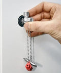 Hand using All-in-One Universal Control Cabinet Key for Gas, Water and Electric Shutoffs, includes 10 x 7 mm slotted bit, PH2 cross.