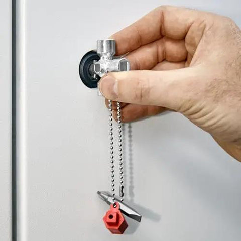 Hand using All-in-One Universal Control Cabinet Key for Gas, Water and Electric Shutoffs, includes 10 x 7 mm slotted bit, PH2 cross.