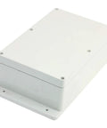 Grey ABS plastic electrical junction box with screw-on lid and mounting flange, angled front view