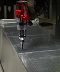 Step Drill Bit No 1 For Cordless Drills At Turbo Speed drilling metal with visible size marks, secure grip, dual flute Milwaukee