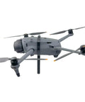 DJI Mavic 4 Pro Handheld Holder Takeoff Landing Mount attached to Mavic 4 Pro Drone, showcasing aerial to ground shooting capability.