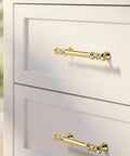 Minimalist Bright Gold Aluminum Alloy Cabinet And Wardrobe Handles Set Six Pack installed on white drawers