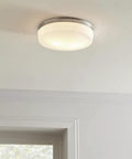 Two Light Flush Mount In Satin Nickel Finish With White Opal Etched Diffuser Patterned Like Emerald Cut Diamond Installed on Ceiling