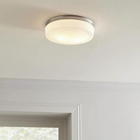 Two Light Flush Mount In Satin Nickel Finish With White Opal Etched Diffuser Patterned Like Emerald Cut Diamond Installed on Ceiling