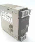Side view of S8VS 06024A 100 To 240 VAC Input 24 VDC Output 60 W Switch Mode Power Supply with screw terminal block.