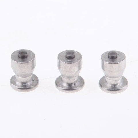 Close-up of removable tungsten carbide ice grip screws for hardcore tire spikes for cars and trucks winter snow chain replacement.