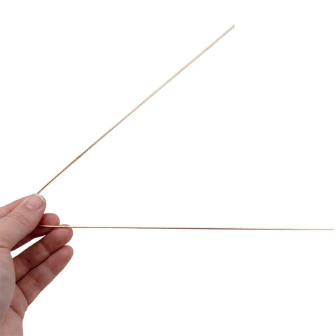Hand holding two 4 Pack Stay Silv 15 Percent Flat Brazing Rods 20 Inch for Copper to Copper HVAC R Applications with Moderate Fit Up.