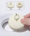 Top Shelf Rubber Tub Stopper With Pull Chain For Bathroom Sink And Shower Drain Cover Fits One Half To Two Inch Kitchen Laundry Plug being removed.
