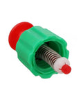 Green plastic pressure-relief valve with red plunger and metal coil spring for backpack garden sprayer