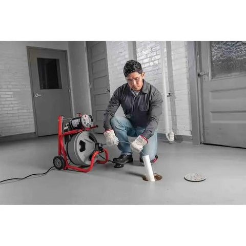 Heavy Duty 115 Volt Electric Conduit Bender Machine Featuring Autofeed And C45 Integral Wound Cable Designed To Bend Rigid Pipe Like Butter, in use by a contractor.