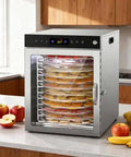 12 Tray Stainless Steel Food Dehydrator With Digital Display And 800 Watt Heating Element drying sliced fruits in clear front window.