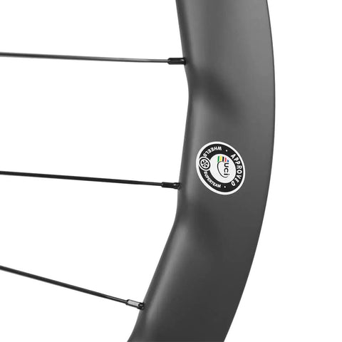 Close-up of Carbon Road Disc Brake Wheelset 700c Tubeless Ready 50C 25mm U Shape Center Lock For Lightweight Speed And Bombproof Braking.