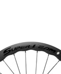 Close-up of Tubeless Disc Brake Road Bike Wheelset 25mm Carbon 700c with 50mm rim, Toray T700 UD finish showcasing branding.