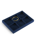 Super Slick Microfiber Jewelry Display Tray With Six Grid Compartments For Ring Earring Bracelet And Necklace Storage Stackable Countertop Organizer Plate Hits Different with a gold bracelet.