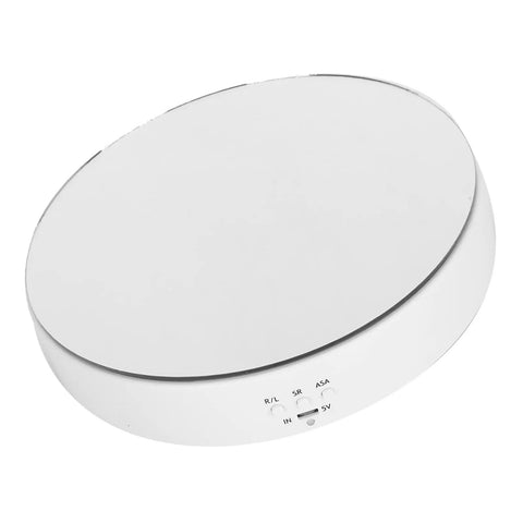 Smooth Rotating Display Stand With Electric Turntable For Jewelry Watches Phones And Bags, Featuring Two Way Gears Adjustable Speed And Mirror Surface Look That Flips The Switch On Any Cool Collection Setup. White round turntable with smooth mirror surface.