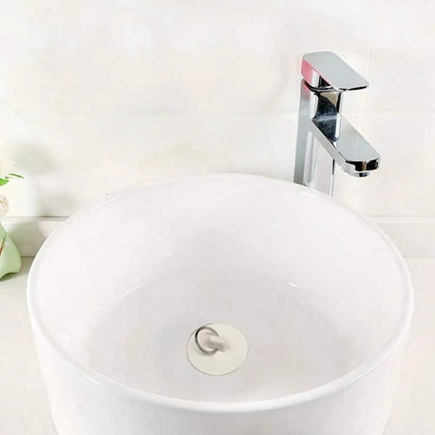 Peirushg Bathtub Easy-Install Stopper Quick 1-3/8in. in a modern white sink with a chrome faucet.