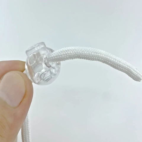 Close-up of transparent orb with rope from Roman Shade Orbs Lock Rope Buckle Kit For Easy Leveling Of Window Treatments Orb Leveling Device