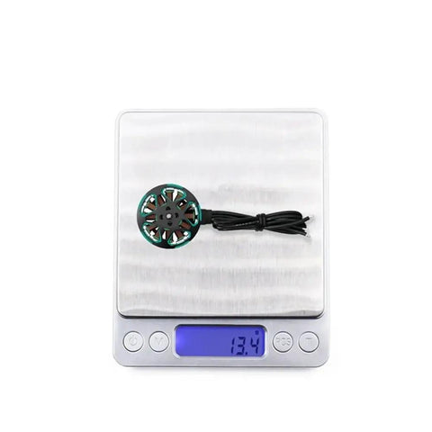 Ultra Lightweight Brushless Motor For 3.5 To 5 Inch FPV Drones 1804 2450KV Or 3450KV on digital scale showing 13.4g