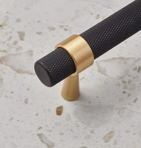 Knurled textured handle of solid brass cabinet pull in black with gold accents, part of a set of 2 with 5 inch hole centers.