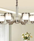 Slick Nickel Four Bulb Led Pendant Chandelier casts pure 5500k white light, featuring four glass shades for modern decor.