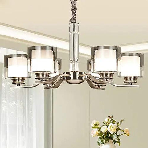 Slick Nickel Four Bulb Led Pendant Chandelier casts pure 5500k white light, featuring four glass shades for modern decor.
