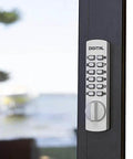Keyless Push Button Surface Mount Hook Bolt Lock for Sliding Doors White Finish with Programmable Code installed on glass door