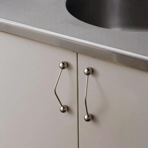 Kitchen cabinet installed with One Pack 5 Inch Titanium Silver Cabinet Handles Ball Tip Pulls With Polished Solid Brass Core And Premium Finish
