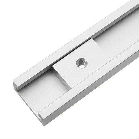 Close-up of a Heavy Duty M8 T Slot Nut Set For Woodworking showing an aluminum alloy T-track slider in a milling table slot.