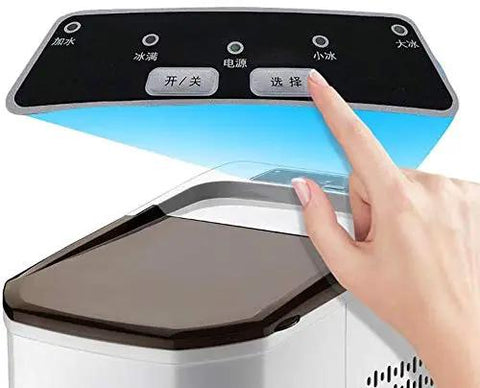 Top view of Compact Automatic Countertop Ice Maker controls with hand touching the panel for selection functionality.
