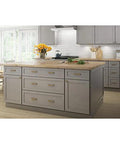 Kitchen island with Champagne Bronze Cabinet Handles 5 Pack Adjustable Drawer Pulls for Cabinets, coordinating with decor.