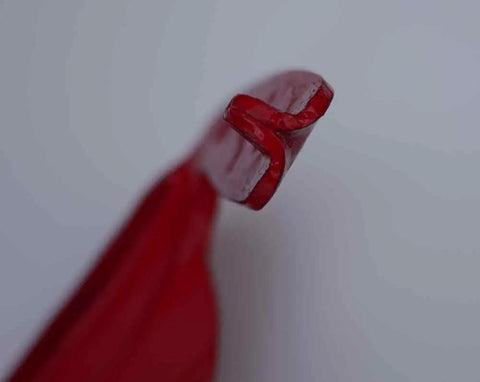 Close-up of the double peen tip on the Wolf Sense Scythe Blade 70cm By 50mm Hand Forged In Austria, showcasing its sharp edge.