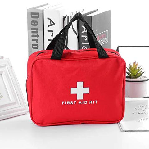 PAXLAMB red first aid bag with white cross and FIRST AID KIT lettering, front view
