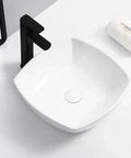 Bathroom Sink Bathroom Vessel Sink Household Ceramic Wash Basin Hotel Countertop Basin Ceramic Vessel Sink Square Art Basin Bathroom Sink Vessel with black faucet top view.